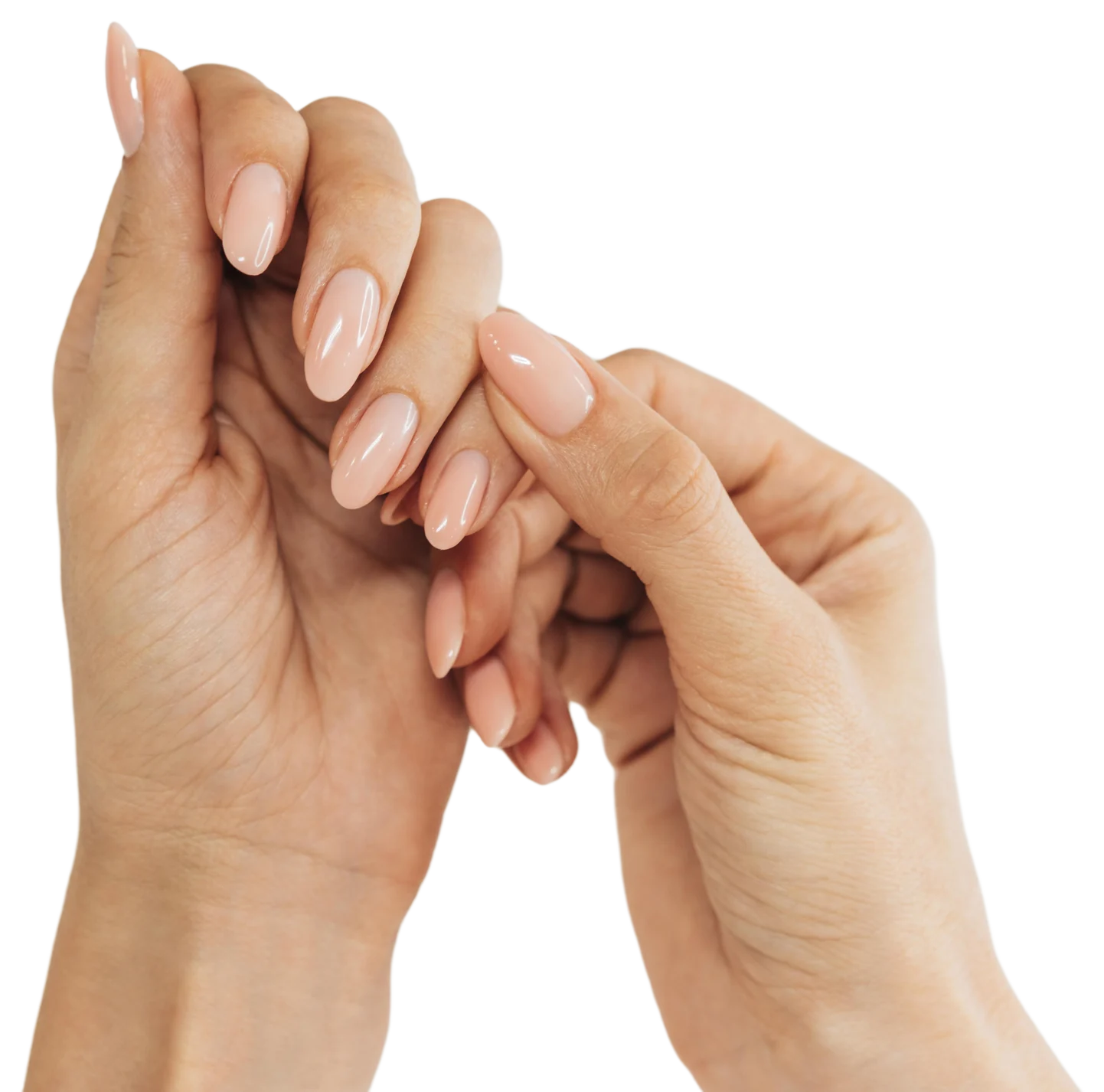 Manicura y pedicura en Santa Isabel, Zaragoza | Christian Peluqueros Manos con uñas largas y esmalte en tono nude: manicura y pedicura en Santa Isabel, Zaragoza, en Christian Peluqueros